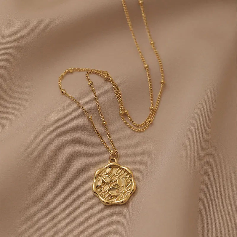 Donna you Colar com pingente redondo floral dourado